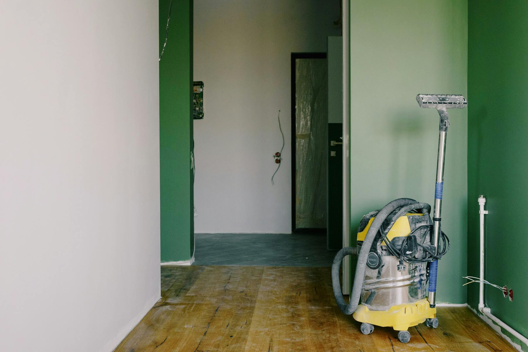 Water cleanup and drying equipment inside a damaged room